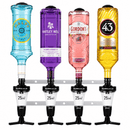 Four BarBits Solo 25ml spirit measure bottles mounted on a metal rack, filled with blue, purple, pink, and gold liquids. The bottles feature colorful glass bodies with black and white measurement sections and black spouts.