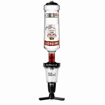 A Smirnoff vodka bottle inverted on a black and clear triple-prong stand with a 50ml measurement chamber. The Smirnoff label is visible, along with BarBits branding on the connector collar.