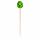 Green leaf-shaped cocktail pick on a white background