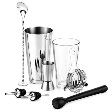 A 8-piece stainless steel and glass cocktail muddler set on a white background, including a shaker, mixing glasses, strainer, muddler, and pourers.