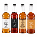 Four bottles of Beaumont syrup in different flavors on a white background