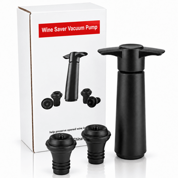 A black wine saver vacuum pump set with its white retail box. The set includes a main pump cylinder with a wing handle, two small black adapter nozzles, and the white box printed with the product name 'Wine Saver Vacuum Pump' and small product illustrations.