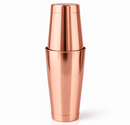 A rose gold stainless steel boston cocktail shaker, tin on tins shown on a clean white background.
