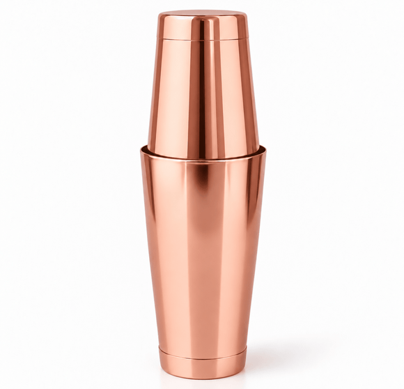 A rose gold stainless steel boston cocktail shaker, tin on tins shown on a clean white background.