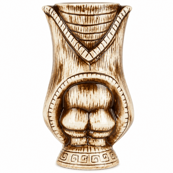 A ceramic tiki mug designed to look like a carved wooden statue, featuring a V-shaped notch at the rim and a recessed face with a stylized chest design, in a light natural wood finish with dark brown burn-like detailing, shown on a plain white background.