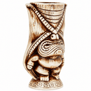 A carved ceramic tiki mug featuring a stylized frog design with crossed arms, detailed with dark brown burn marks on a cream-colored base, set against a plain white background.