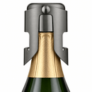 A close-up of a champagne bottle with a Champagne Stopper in a Gunmetal finish shown against a plain white background.
