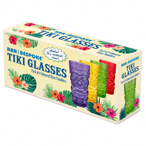 A boxed set of four tiki-style glass tumblers shown on a plain white background. The cream-colored packaging features tropical floral and leaf illustrations and large blue text reading 'BAR | BESPOKE TIKI GLASSES' and 'Pack of 4 Coloured Glass Tumblers.