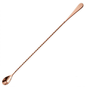 Rose gold bar spoon on a white background