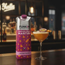 Funkin pre-mixed cocktail packaging next to a passion fruit martini in a bar setting