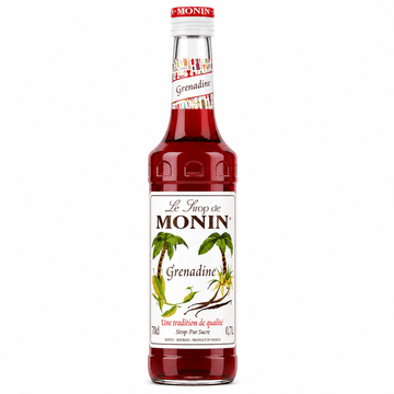 A bottle of Le Throp de MONIN Grenadine syrup, featuring a white label with green palm tree illustrations and a red cap, set against a plain white background.