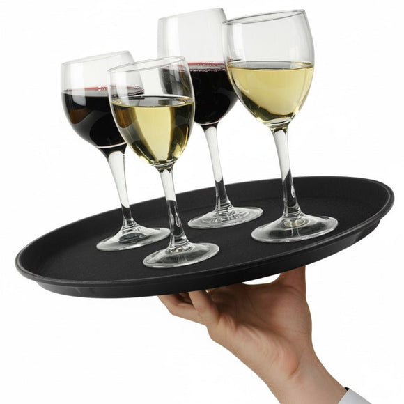 Hand holding a black tray with four wine glasses containing different types of wine on a white background