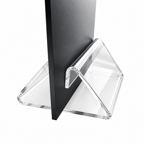 Clear acrylic triangular display stand holding a black vertical board, photographed on a white background.