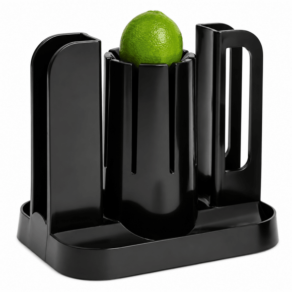 A glossy black plastic citrus juicer with a lime resting inside the central cup, photographed on a clean white background.