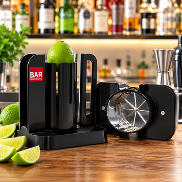 A black professional bar citrus juicer set shown on a wooden bar counter with limes, featuring a juicer body with a red and white 'BAR PROFESSIONALS' logo, a separate metal press component, and lime slices in the foreground.