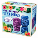 A boxed set of two ceramic tiki mugs on a plain white background. The front of the package shows tropical floral and leaf graphics, large text reading 'BAR / BESPOKE TIKI MUGS,' and illustrations of the two mugs in purple and blue.