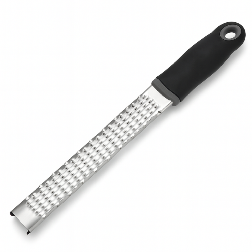 Metal zester with black handle on a white background