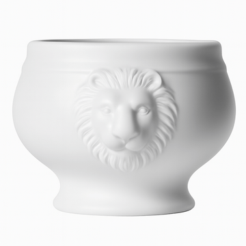 White ceramic pot with lion head design on a white background