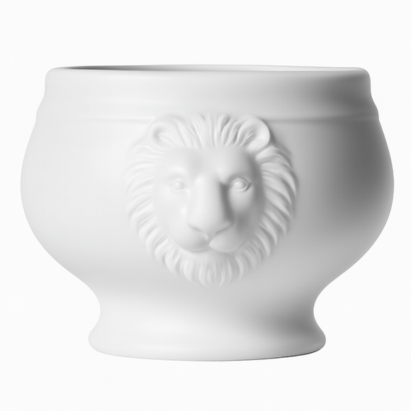 White ceramic pot with lion head design on a white background